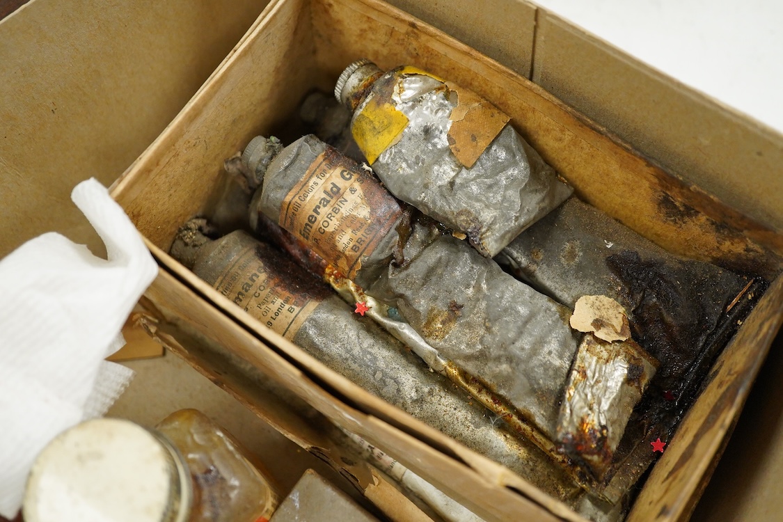 Three early to mid 20th century artist’s paint boxes, one tin box with Winsor and Newton label to the inside of the lid, plus a Rowley labelled box, a wooden paint box- 39cm wide, together with a leather pencil case, the